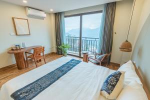 Postel nebo postele na pokoji v ubytování Sapa Yen Hotel