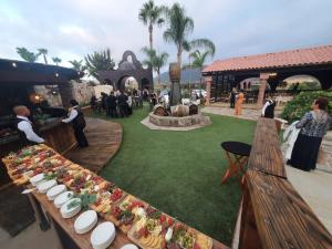 a table with plates of food on top of it at Finca Selah in Ensenada