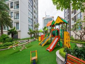 a playground with a slide in a park at Vincom Plaza Vinhomes Sky Lake Phạm Hùng Mỹ Đình in Hanoi