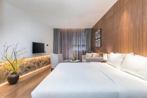 Postel nebo postele na pokoji v ubytování Hangshe Hostel Fuzhou