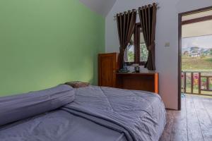 Voodi või voodid majutusasutuse Bale Gantar toas