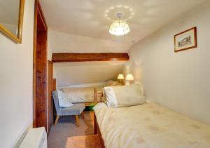 Un pat sau paturi într-o cameră la Lower Rheol