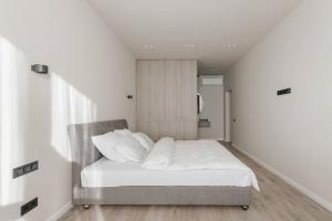 Posteľ alebo postele v izbe v ubytovaní Noviy Bereg Design Apartment
