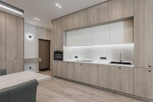 Kuchyňa alebo kuchynka v ubytovaní Noviy Bereg Design Apartment