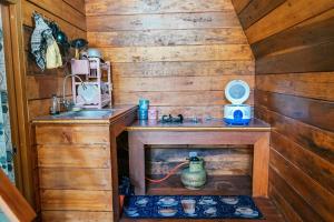 a small kitchen with a sink and a sink at Golden Orchid Villa in Diyeng