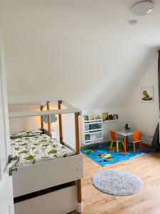 a bedroom with a bunk bed and a table at Pool, Sauna und Blick ins Grüne in Lutherstadt Wittenberg +25 photos