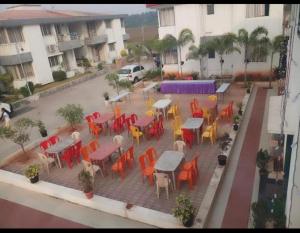 an overhead view of a patio with tables and chairs at Hotel Ecotel in Nagaon