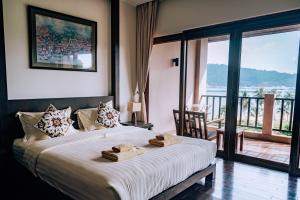 Postel nebo postele na pokoji v ubytování Tina Holiday Homes