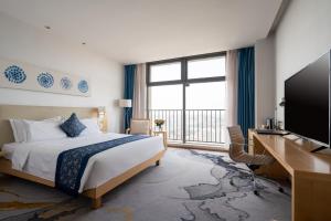 Krevet ili kreveti u jedinici u okviru objekta 石家庄华强诺华廷酒店 Novlion hotel