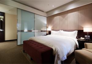 Katil atau katil-katil dalam bilik di The Tango Hotel Taipei XinYi