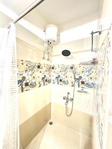 a bathroom with a shower with a shower curtain at KPHB Phase 15 New Stunning 3 BHK - 1st Floor in Hyderabad