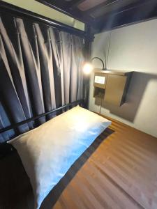 Postel nebo postele na pokoji v ubytování Inn Trog And Inn Soi
