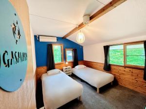 Postel nebo postele na pokoji v ubytování Moment Chalet Hakuba