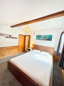 Postel nebo postele na pokoji v ubytování Moment Chalet Hakuba