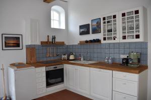 A kitchen or kitchenette at Ferienwohnung An der Mühle