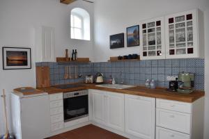 Η κουζίνα ή μικρή κουζίνα στο Ferienwohnung An der Mühle
