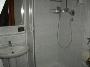 a bathroom with a shower and a sink at Hotel Euro in Genoa