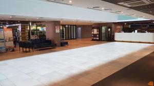 a large empty dance floor in a store at Noblepia Hotel in Seogwipo