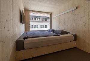 Postel nebo postele na pokoji v ubytování Revier Mountain Lodge Adelboden