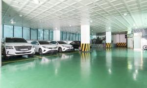 a row of cars parked in a garage at Hotel Feel Green in Goyang