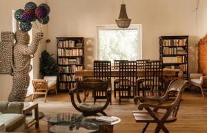 a living room filled with furniture and a table with balloons at Mia Glamping in Orissaare