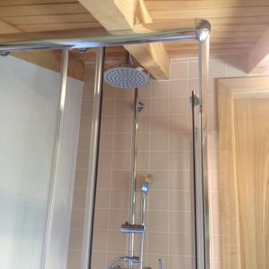 a shower in a bathroom with a shower curtain at Casa Da Pena in Góis