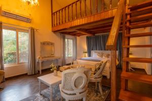 a bedroom with a bunk bed and a wooden ladder at Seclude Kasauli, Himachal Pradesh in Kasauli