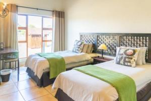 Кровать или кровати в номере Zebula Golf and Wildlife Estate - Hornbill Paradise Pax 8 - Moi Signature Luxury villa