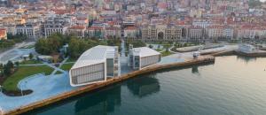 an aerial view of a building on a pier in the water at Apartamento tranquilo y céntrico en Santander in Santander