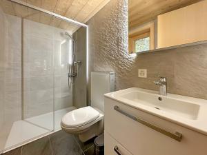 a bathroom with a toilet and a sink and a shower at Chalet a Didi - Alps Paradise - 4 Vallees in La Tzoumaz +19 photos