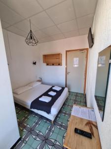 Postel nebo postele na pokoji v ubytování Hotel Le Centre