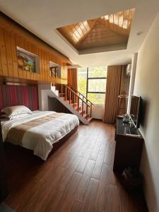 Postelja oz. postelje v sobi nastanitve Family Hotel Zhangjiajie