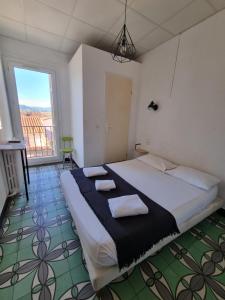 Postel nebo postele na pokoji v ubytování Hotel Le Centre
