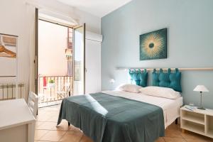 מיטה או מיטות בחדר ב-Punto al Capo Appartamento intero o stanze matrimoniali con bagno privato