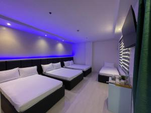 Letto o letti in una camera di Central Block Inn