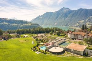 an aerial view of a resort with a lake and mountains at Swiss Holiday Park Resort in Morschach