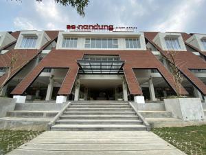 a building with stairs in front of a building at Se.nandung Living and Space in Malang