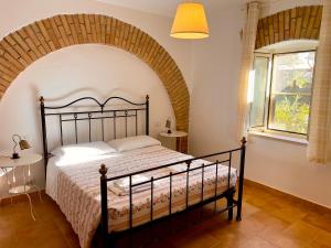 Postel nebo postele na pokoji v ubytování Carpine Agriturismo Bio in Maremma