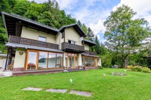 a house with a large lawn in front of it at local tax 3 Eur guest for night in Semmering
