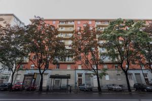 a large building with trees in front of it at Modern House Santa Rita by Wonderful Italy in Turin