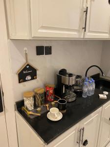 a kitchen counter top with a coffee maker on it at استديو انيق وجميل بدخول ذاتي in Riyadh