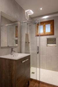 a bathroom with a sink and a shower at Buccara Casa Ca'n Daniel II in Pollença