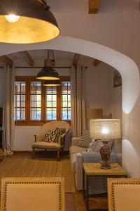 a living room with a couch and a table at Buccara Casa Ca'n Daniel II in Pollença