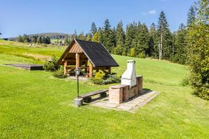 Vonkajšia záhrada v ubytovaní Apartament Marmot Deluxe Zakopane