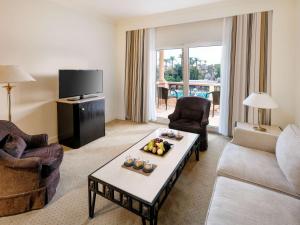 a living room with a couch and a table at Pavillon Winter Luxor in Luxor