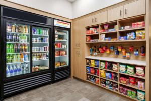 a room with two refrigerators and food at Hyatt Place Orlando / I-Drive / Convention Center in Orlando