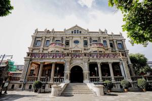 a large building with stairs in front of it at Conrad Shenyang in Shenyang