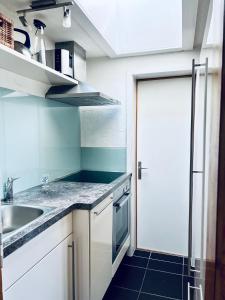Kuhinja oz. manjša kuhinja v nastanitvi Chalet Gauschla - CharmingStay
