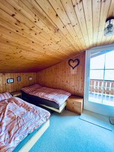 Postel nebo postele na pokoji v ubytování Chalet Gauschla - CharmingStay