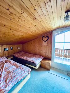 Postelja oz. postelje v sobi nastanitve Chalet Gauschla - CharmingStay